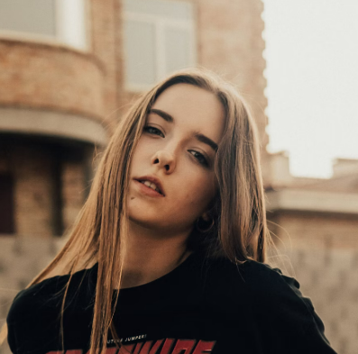 a young girl in a black T-shirt