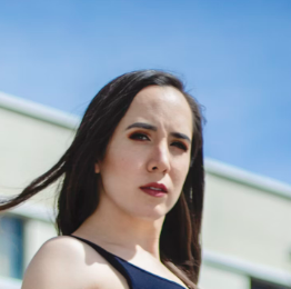 a woman with black hair and red lips